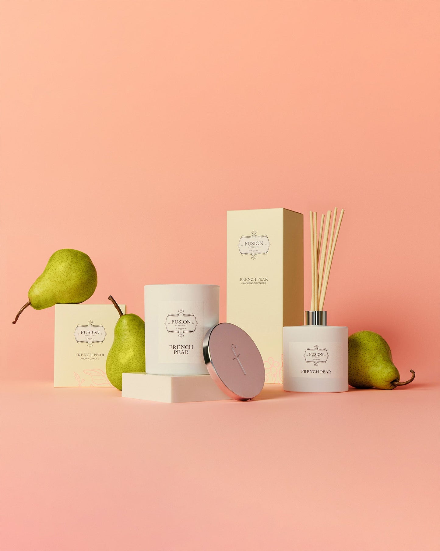 Elegant display of French Pear scented products, including a candle and diffuser, with fresh pears on a soft peach background. Calm, luxurious atmosphere.